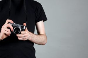 Photographer with retro style camera